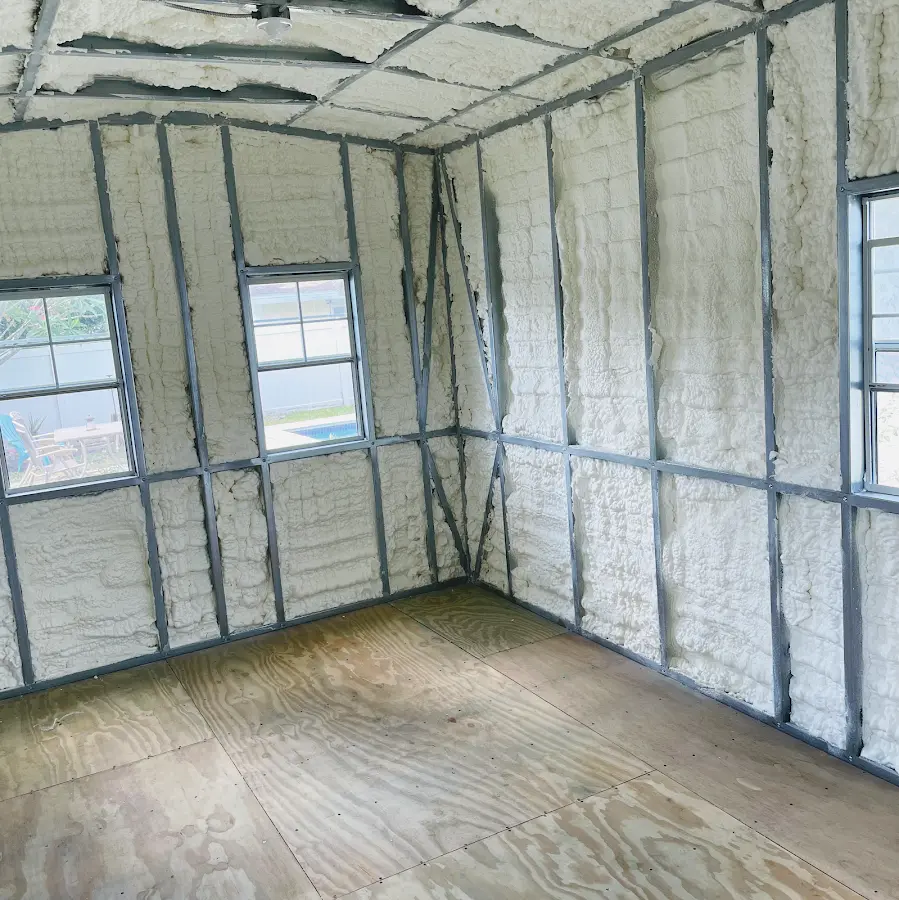 Closed-cell spray foam insulation applied to wall cavities in a residential project in Johnsburg